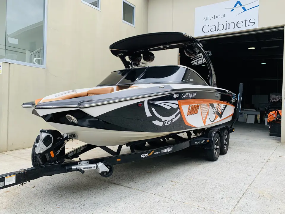 Boat on a trailer outside the workshop