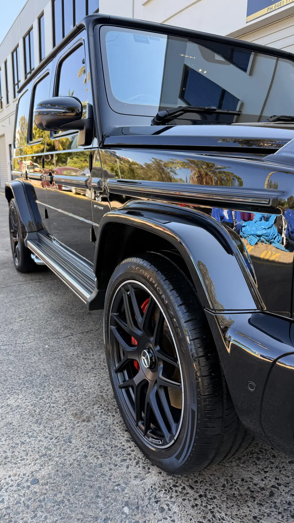 Black Mercedes-Benz G-Class reflecting its surroundings
