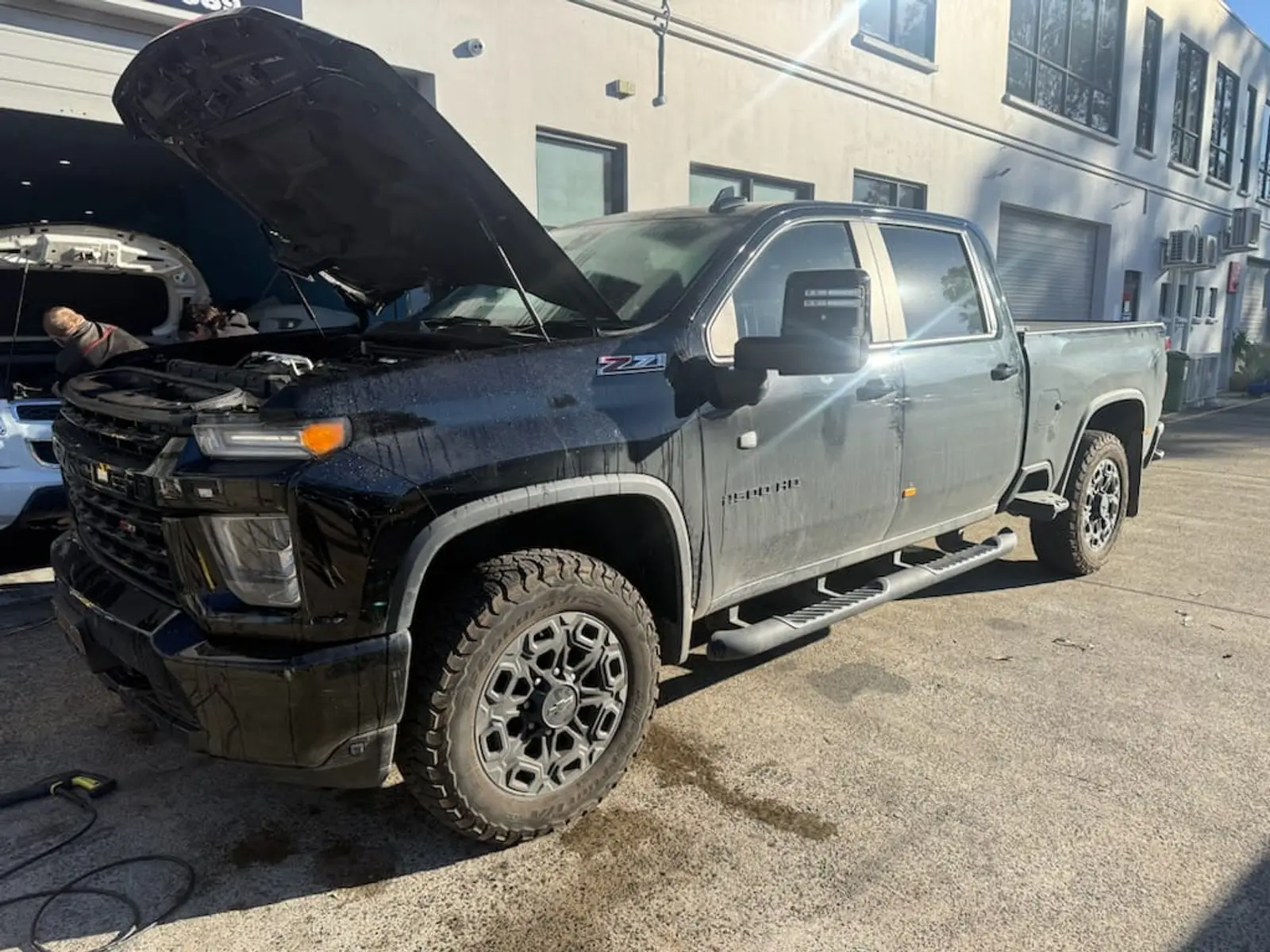 Before: Black dual-cab ute from the business’s published before and after sequence